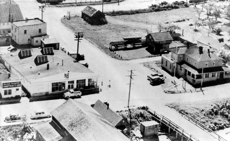 Coupeville block house with canoes and cross